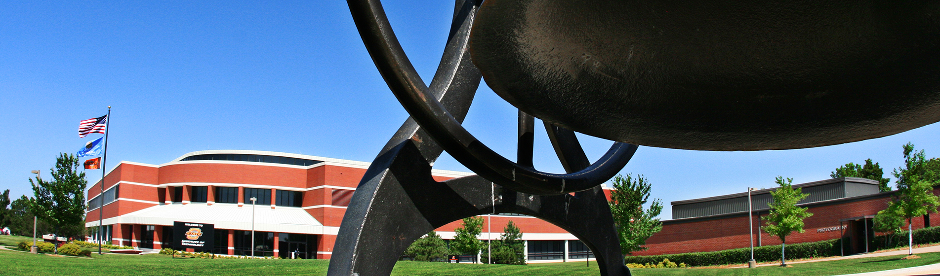 Bell outside of Donald W. Reynolds Technology Center
