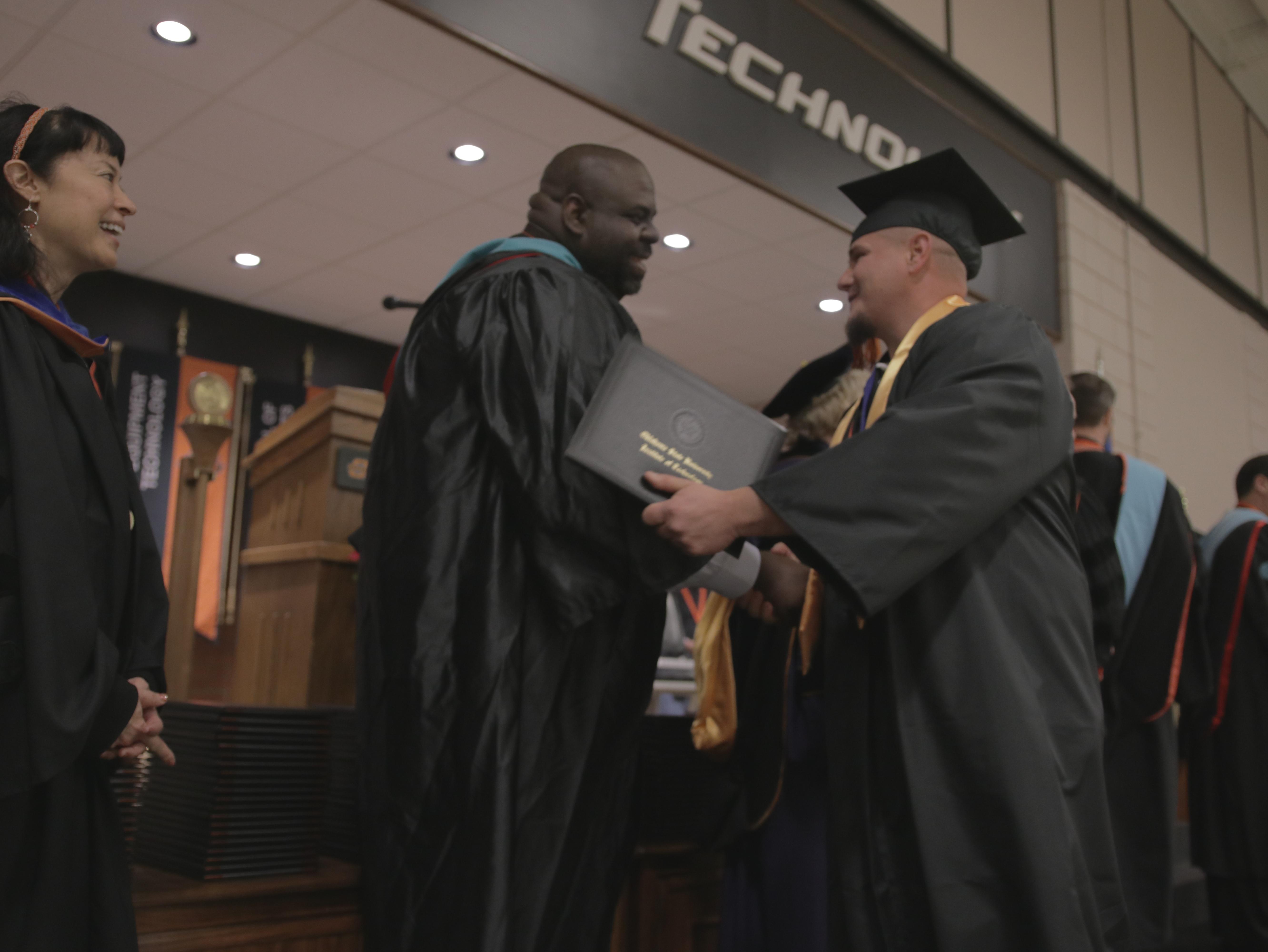Nate Todd with graduate at Fall 2018 Graduation Ceremony